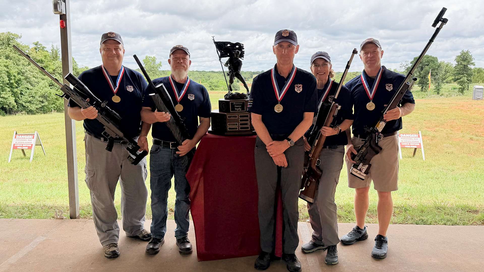 The five members of Team USNRT-Rowe standing together after winning the Mid-Range Any Sight Team title
