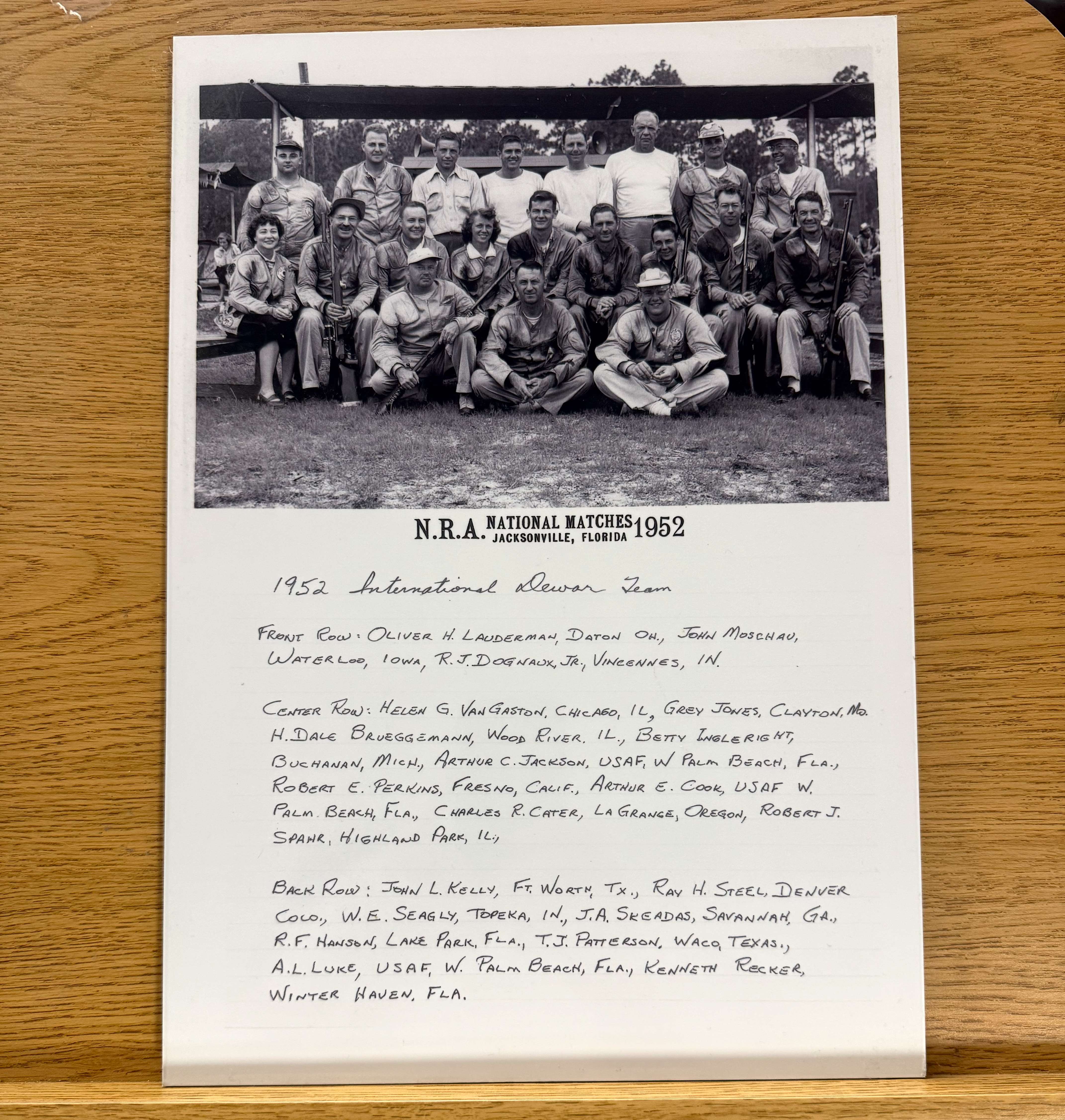 Black and white group photograph of the 1952 U.S. International Dewar Team, roughly 20 smallbore rifle competitors posed in three rows with rifles