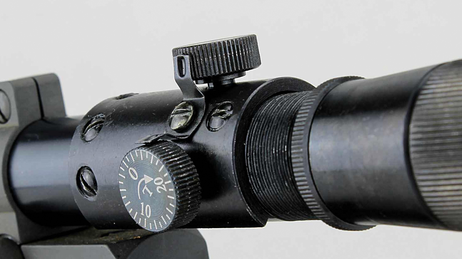 Adjustment clicks for the M73G4 sniper optic, via sheet-metal tabs engaging knob serrations, are positive but fine.
