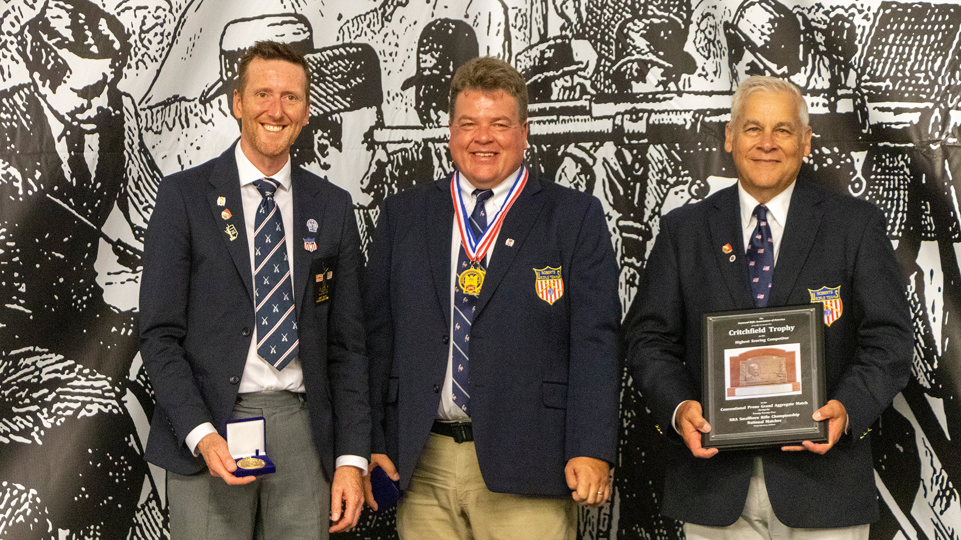 Smallbore competitors with plaques and medals