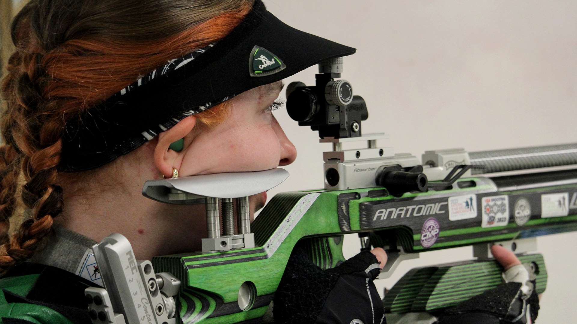 Schreiner University rifle athlete Molly Mitchell holds a rifle