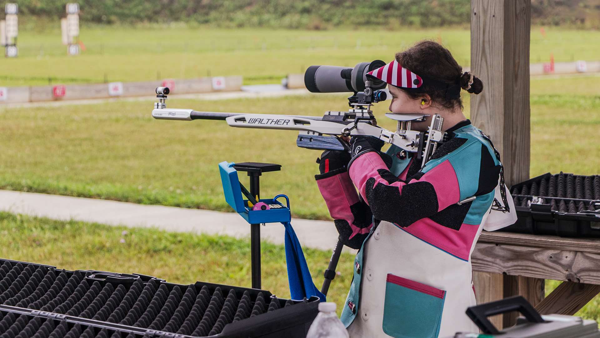 Junior shooter in standing position on firing line at NRA Smallbore Nationals at Ohio's Cardinal Center in 2025