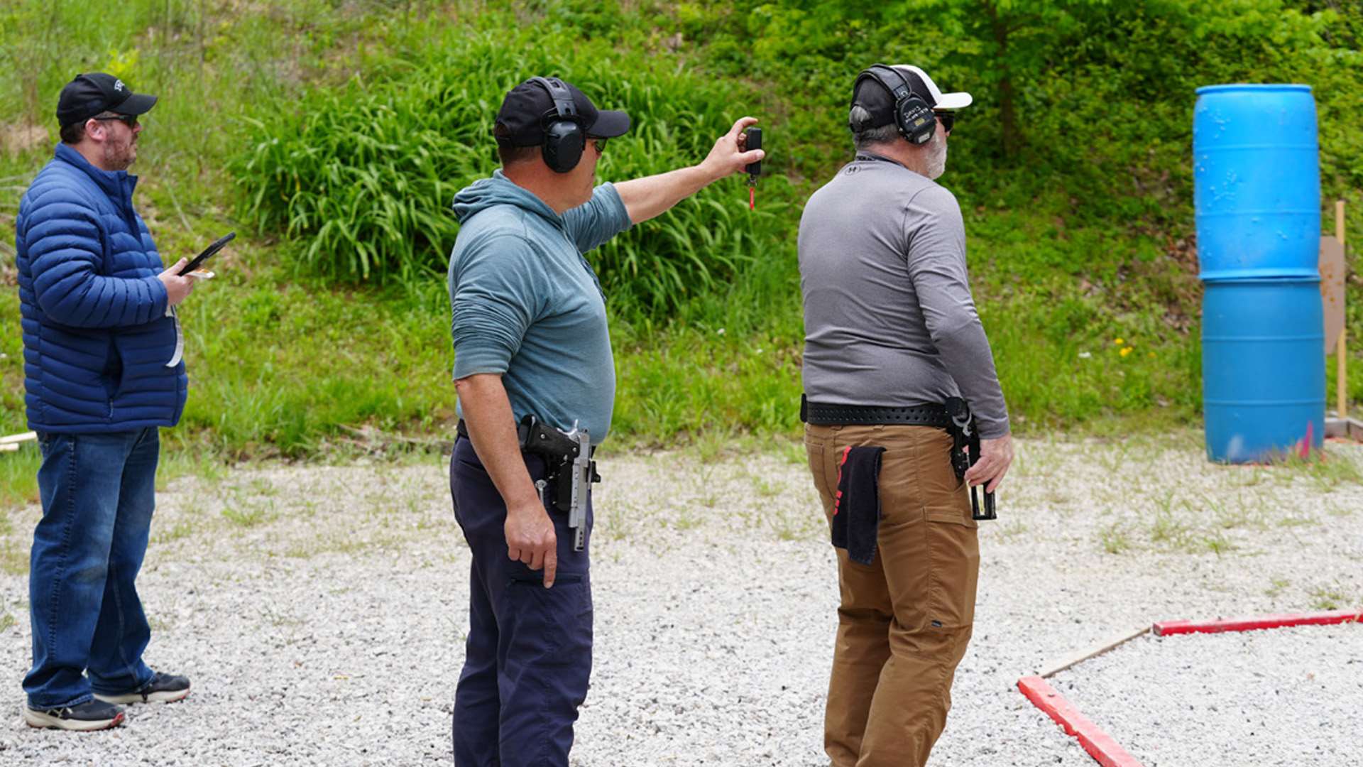 USPSA competitor and range staff before a stage begins