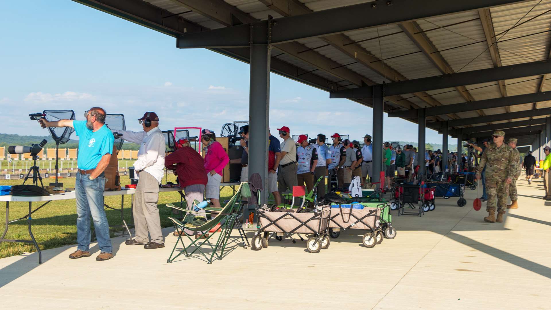 Pistol shooters on covered range