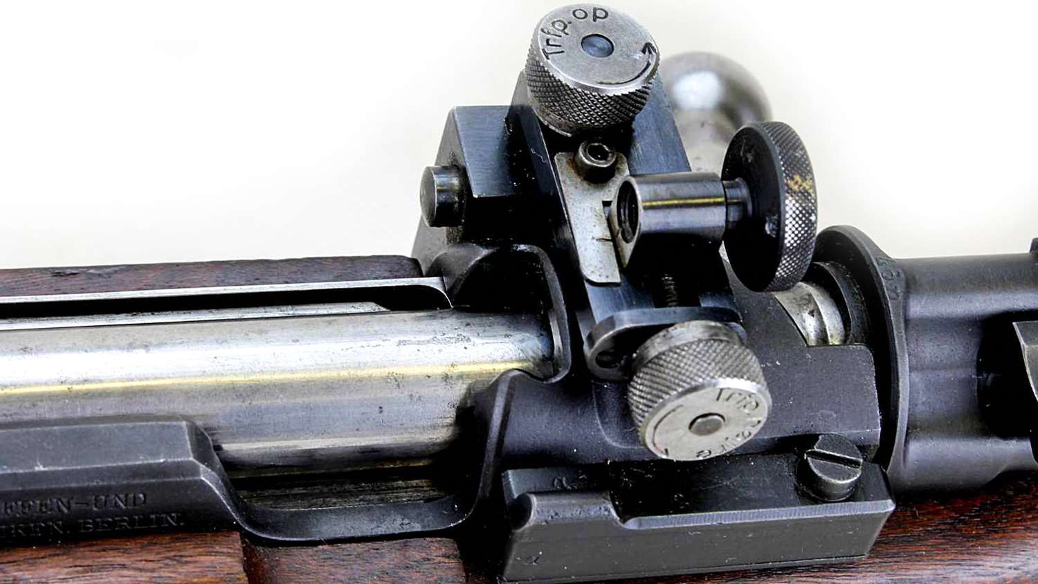 The rear sight appears to be graduated with 10mm clicks. The receiver retains its clip slot for rapid fire stages
