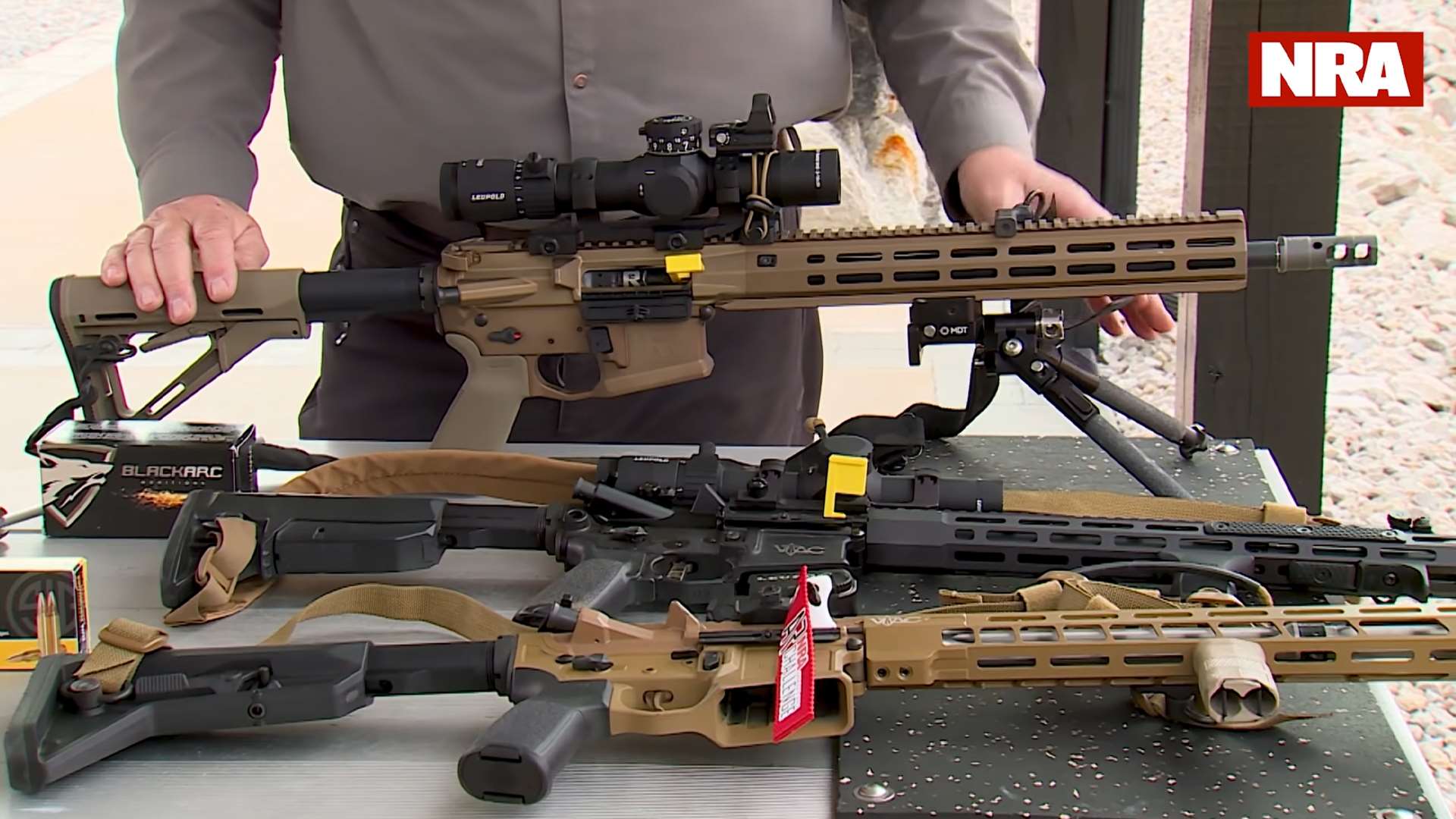 NRA ARC Open, Limited and Stock division rifles on table with optics