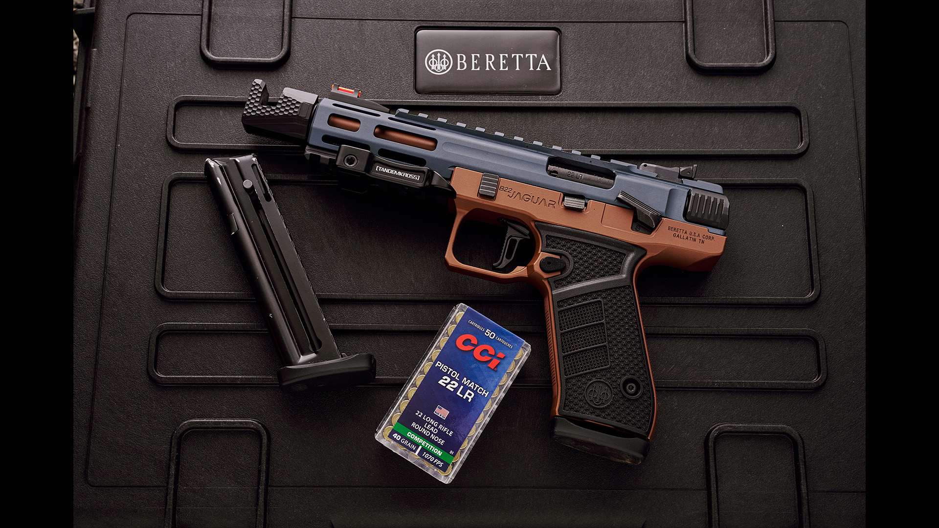 Beretta B22 Jaguar Metal Competition pistol in bronze and gray with magazine and CCI Pistol Match .22 LR ammunition