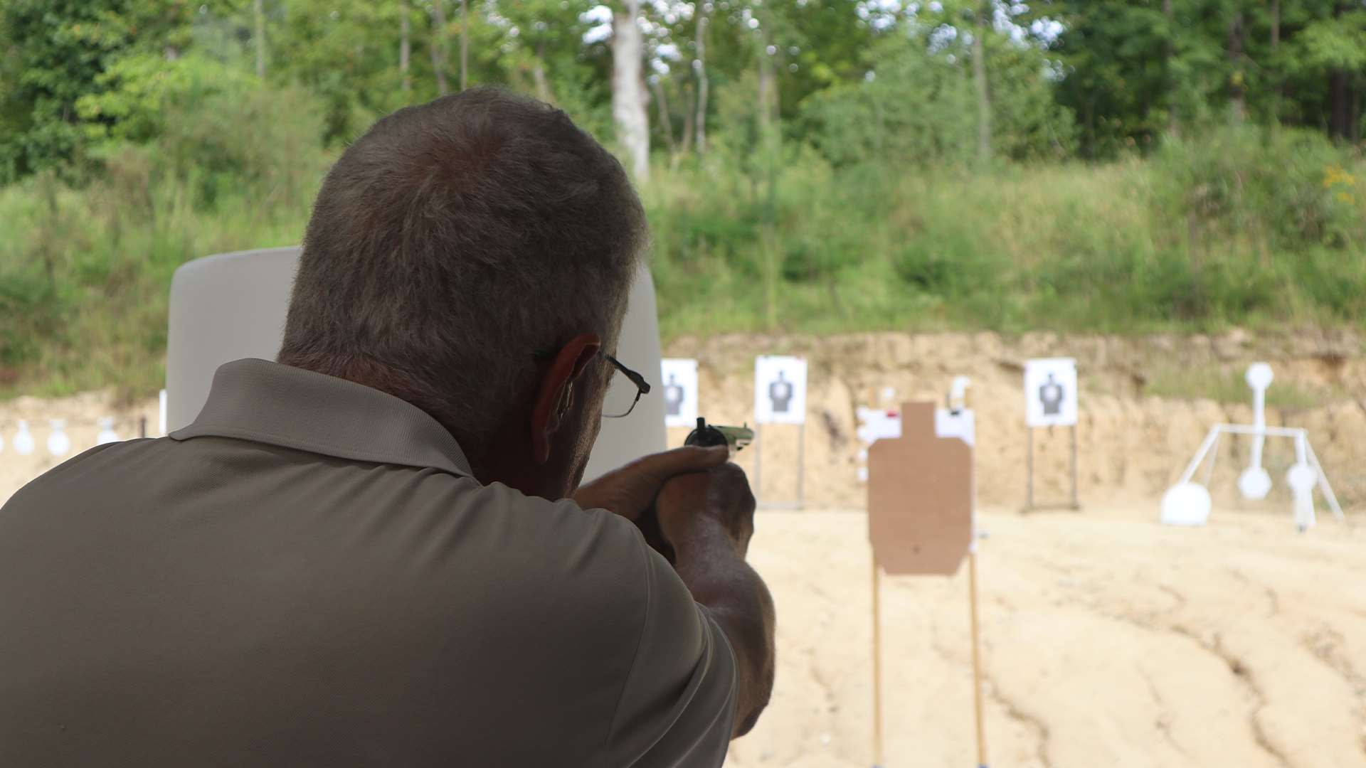 Dick Jones firing a gun