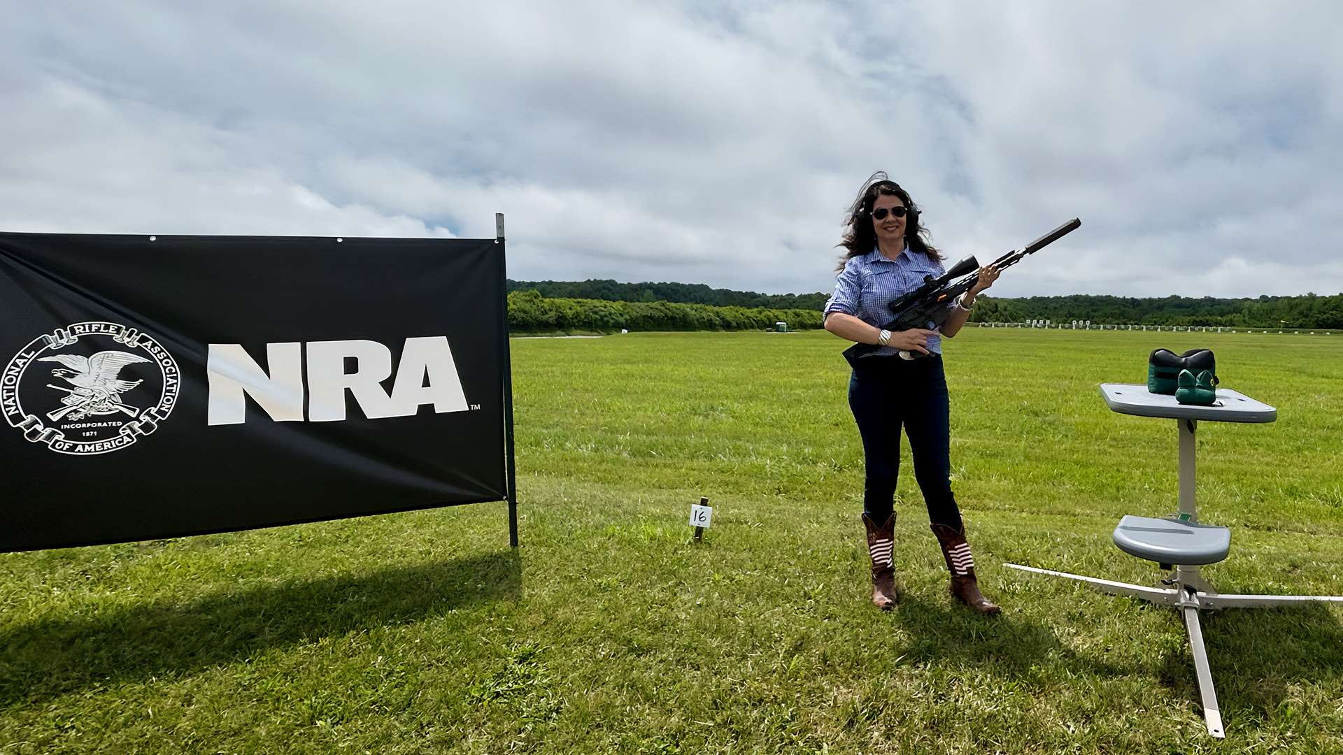 Janet Holcomb with rifle