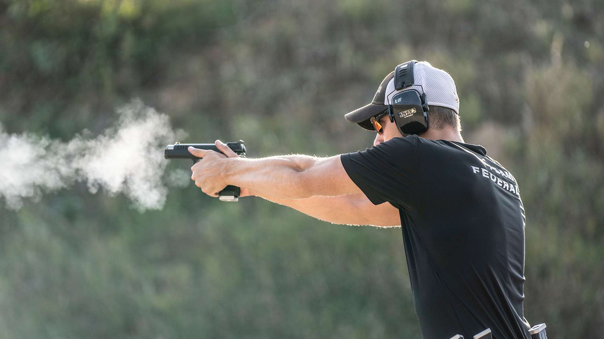 Casey Reed with pistol