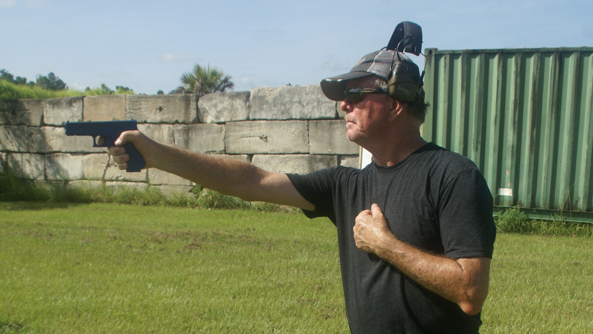 John Reilly displays one-handed pistol grip