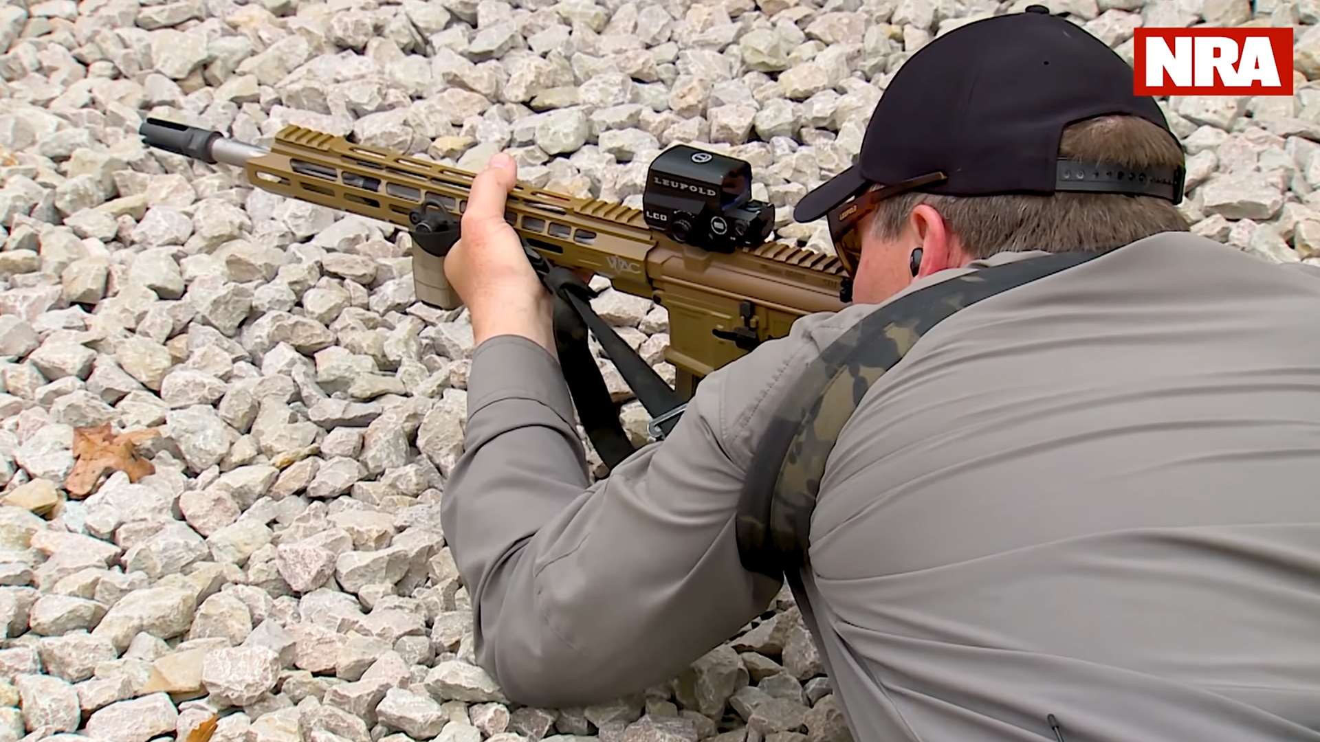 Lamb in prone position with sling tightened, showing elbow drop and sling tension on support arm