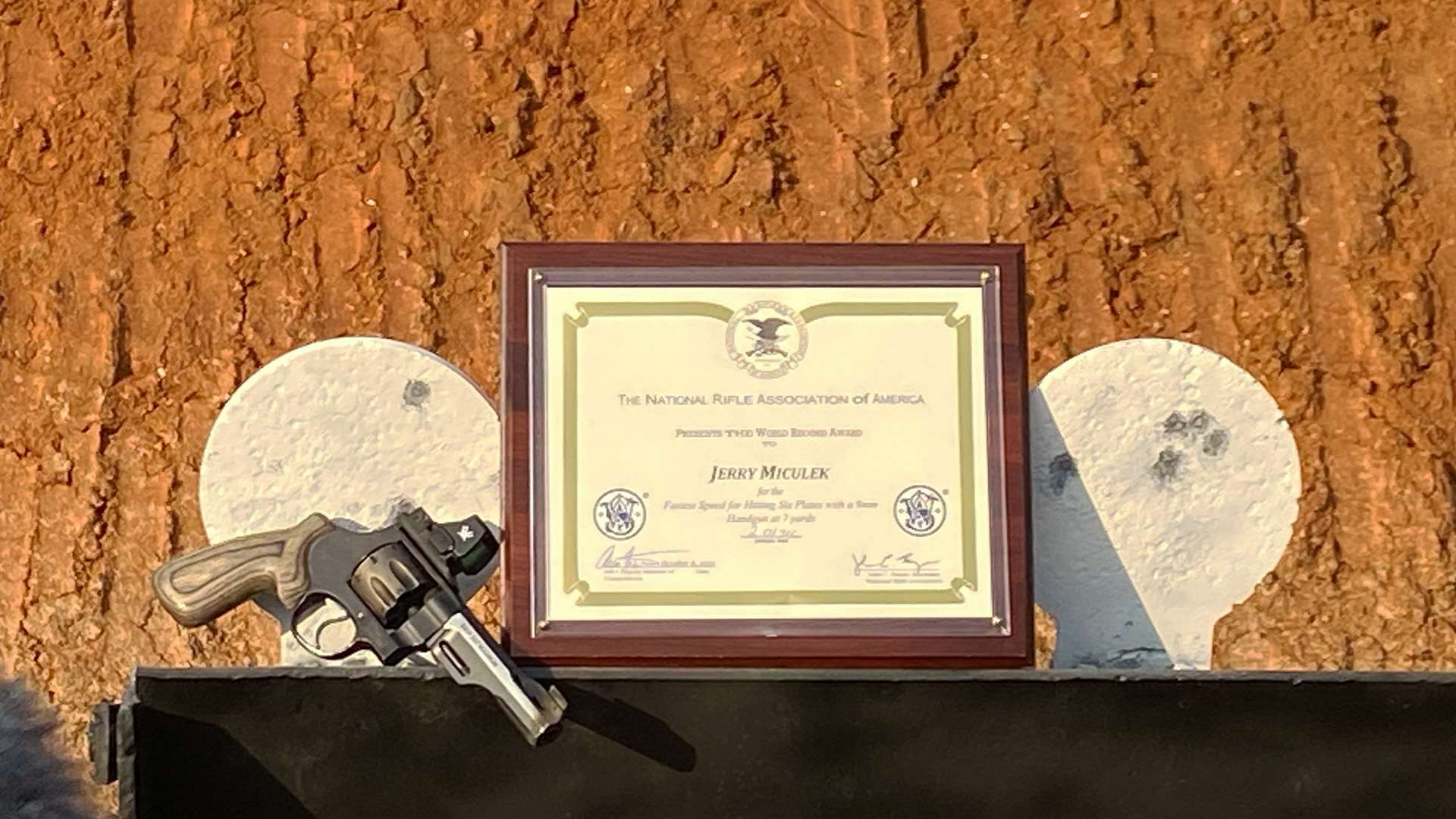 Revolver and plaque on plate rack