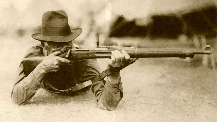 George R. Farr with rifle