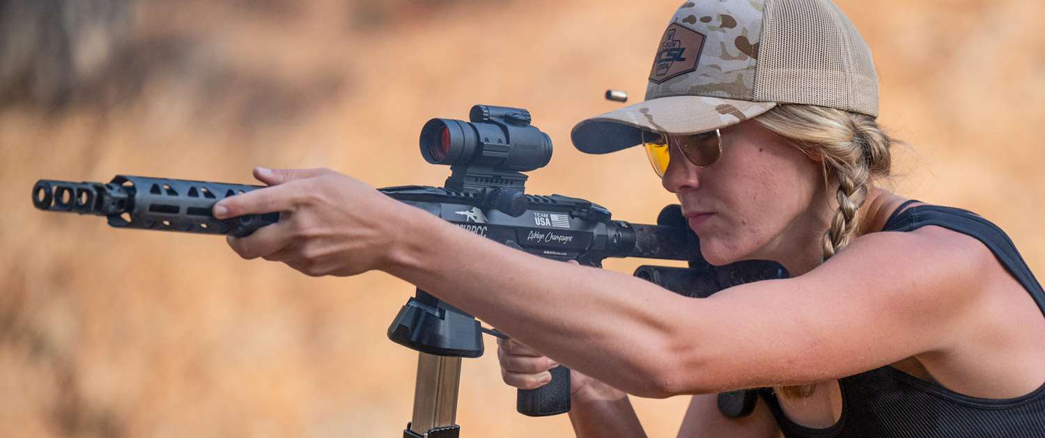 Ashlyn Champagne with carbine