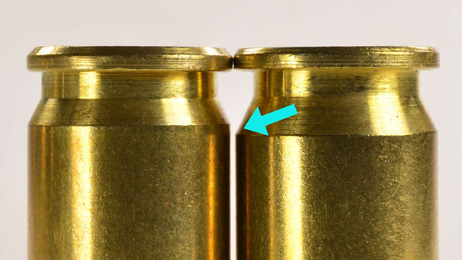 The arrow notes that the extractor groove on the .38 TJ (right) is a little wider than for the .38 Super Comp.