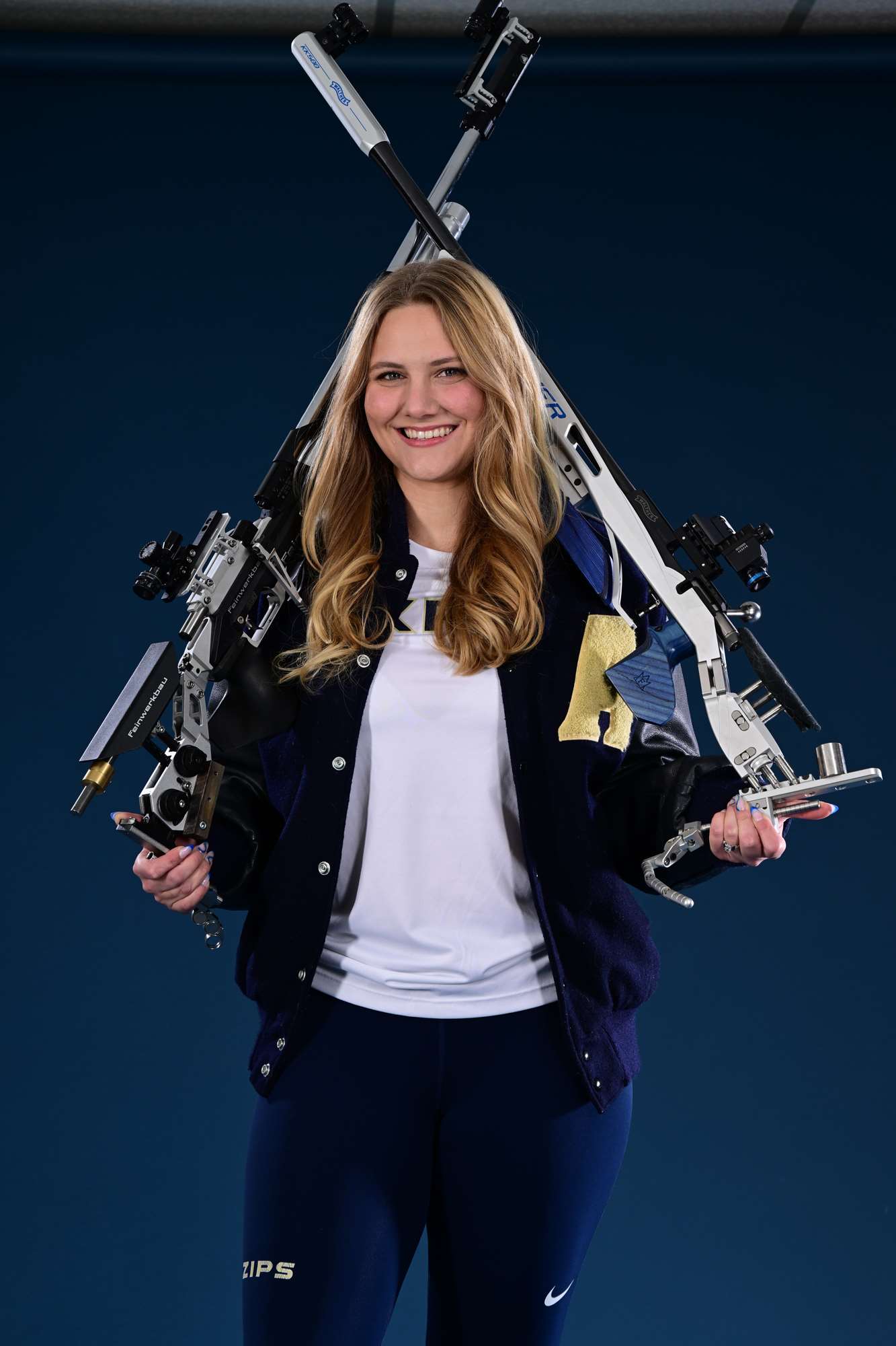 Erin Schnupp with rifles