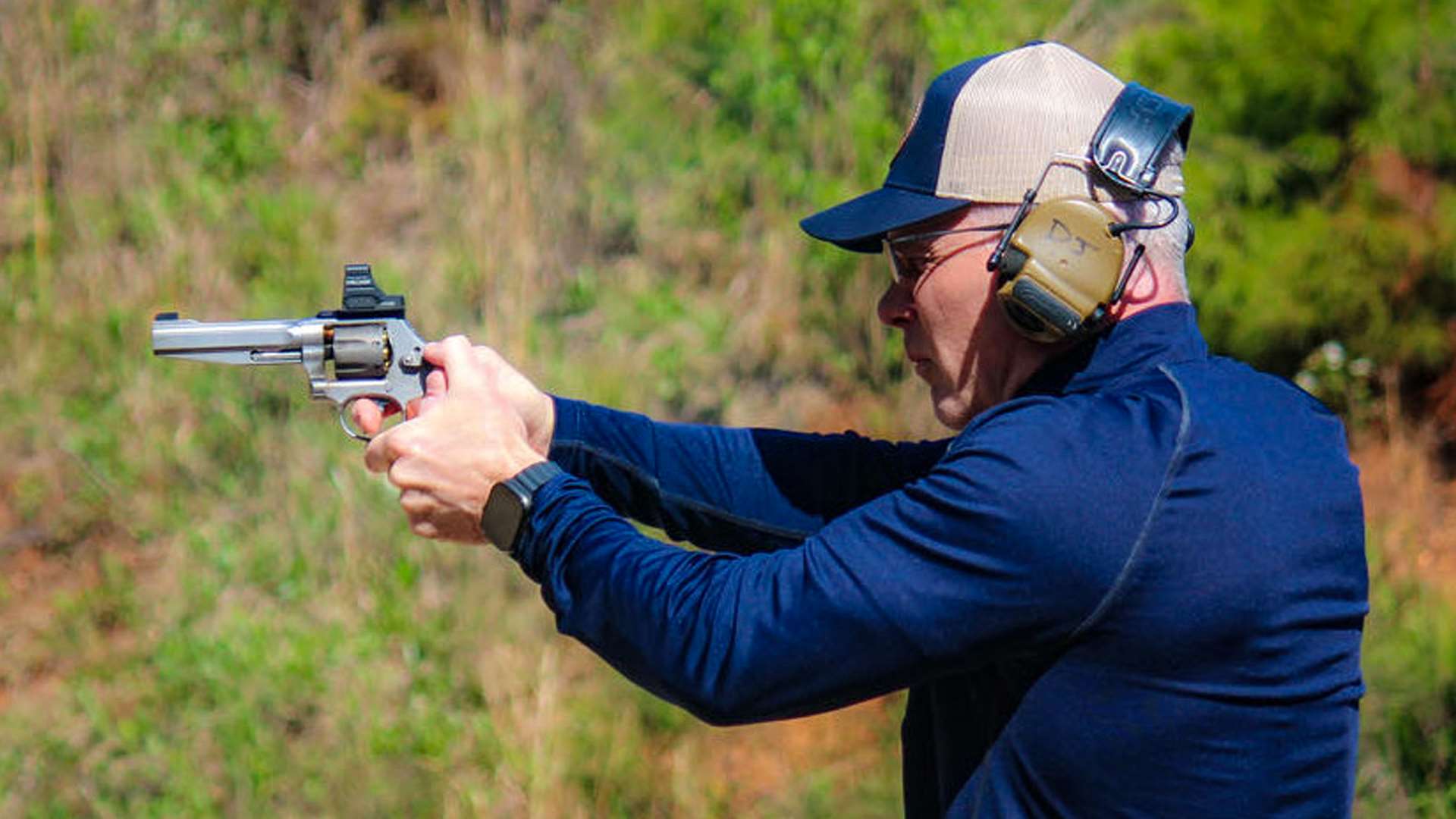 David “DJ” Rotigel shoots his Smith &amp; Wesson 986 revolver at steel targets during a Steel Challenge match